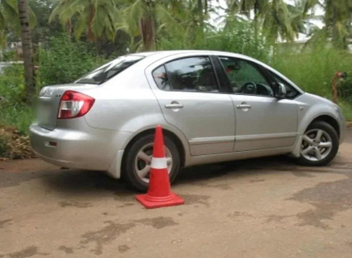 Sedan passing a cone