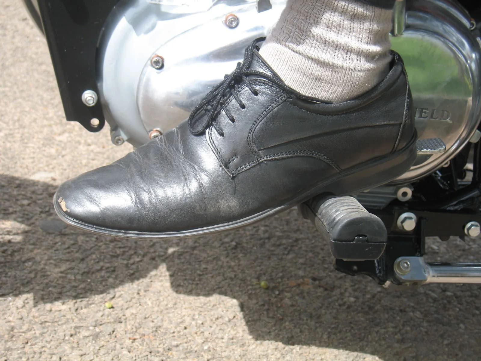 Footwear on the footpeg